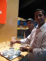 Chuda Ghimirey, Bhutanese coordinator checking the spices in their kitchen 